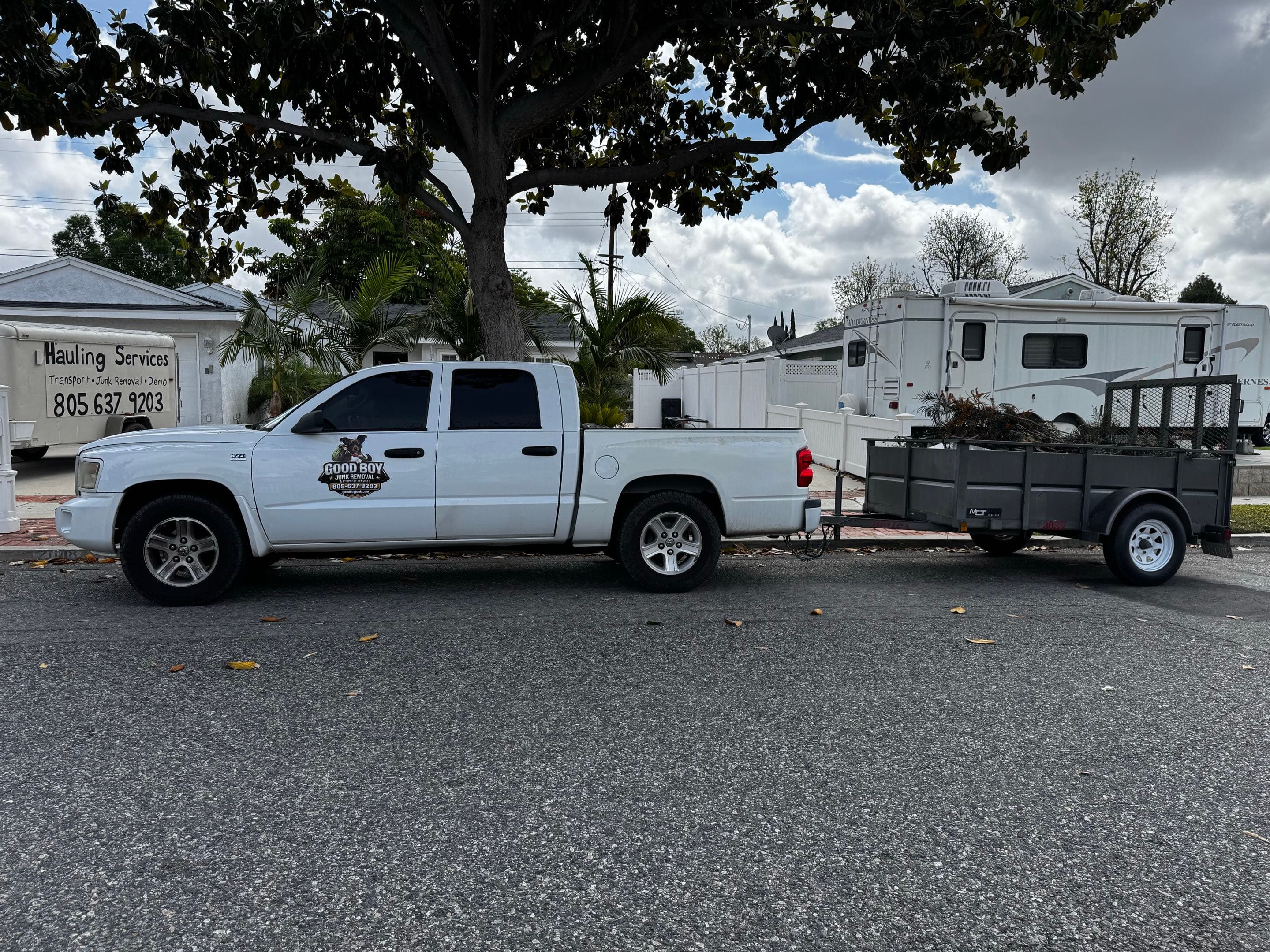 Good Boy truck and utility trailer ready for hauling work